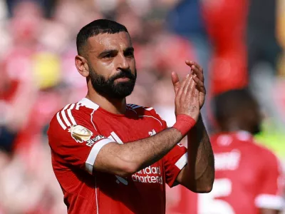 FILE PHOTO: Soccer Football - Premier League - Liverpool v Crystal Palace - Anfield, Liverpool, Britain - April 25, 2026 Liverpool's Mohamed Salah applauds fans as he walks off the pitch after being substituted REUTERS/Phil Noble EDITORIAL USE ONLY. NO USE WITH UNAUTHORIZED AUDIO, VIDEO, DATA, FIXTURE LISTS, CLUB/LEAGUE LOGOS OR 'LIVE' SERVICES. ONLINE IN-MATCH USE LIMITED TO 120 IMAGES, NO VIDEO EMULATION. NO USE IN BETTING, GAMES OR SINGLE CLUB/LEAGUE/PLAYER PUBLICATIONS. PLEASE CONTACT YOUR ACCOUNT REPRESENTATIVE FOR FURTHER DETAILS../File Photo