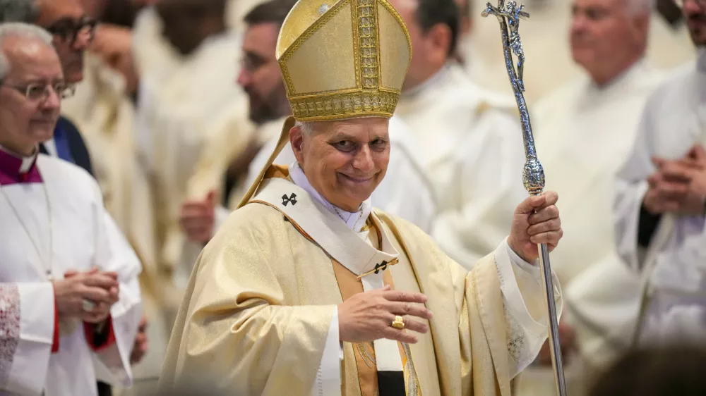 Pope Leo XIV leaves after presiding over Sunday Mass in St. Peter's Basilica at the Vatican during which he made ten new priests, Sunday, April 26, 2026. (AP Photo/Alessandra Tarantino)