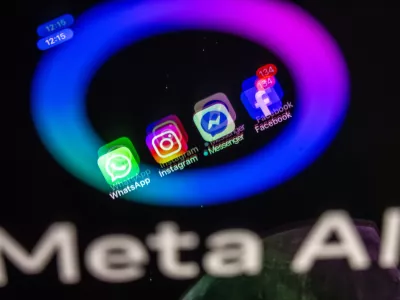 FILED - 27 May 2025, Mecklenburg-Western Pomerania, Schwerin: The Facebook, Messenger, Instagram and WhatsApp apps are shown on a smartphone display that reflects the logo of the AI application Meta AI. Photo: Jens B&uuml;ttner/dpa