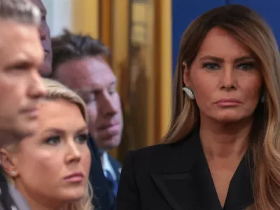 First lady Melania Trump looks on next to White House Press Secretary Karoline Leavitt and U.S. Secretary of Defense Pete Hegseth as U.S. President Donald Trump holds a press briefing at the White House, following a shooting incident during the annual White House Correspondents' Association dinner, in Washington, D.C., U.S., April 25, 2026 REUTERS/Jonathan Ernst   TPX IMAGES OF THE DAY