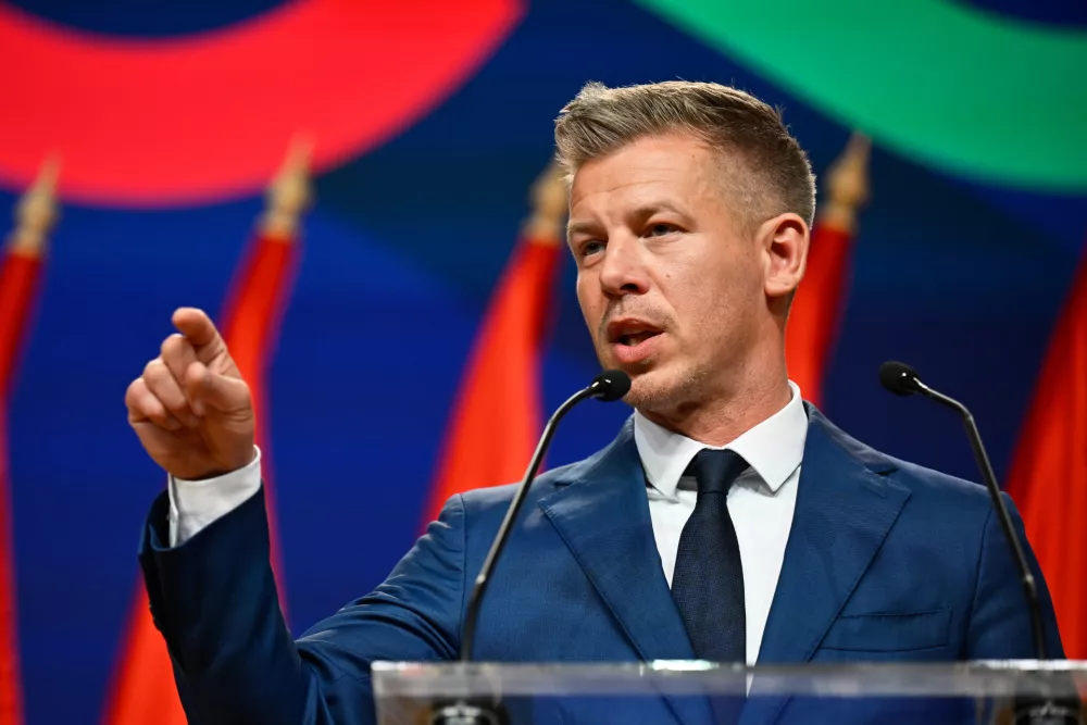 Peter Magyar gestures as he speaks to the media in Budapest, Hungary, Monday, April 13, 2026, after defeating Prime Minister Viktor Orban's party in the country's parliamentary elections. (AP Photo/Denes Erdos)