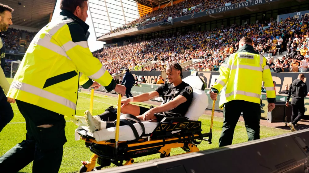 Tottenham Hotspur's Xavi Simons is stretchered off the pitch during the English Premier League soccer match between Wolverhampton Wanderers and Tottenham Hotspur in Wolverhampton, England, Saturday April 25, 2026. (Nick Potts/PA via AP)