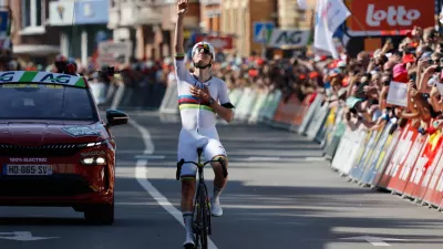 Slovenia's Tadej Pogacar of the UAE Team Emirates crosses the finish line to win the Belgian cycling classic and UCI World Tour race Liege Bastogne Liege, in Liege, Belgium, Sunday, April 26, 2026. (AP Photo/Geert Vanden Wijngaert)