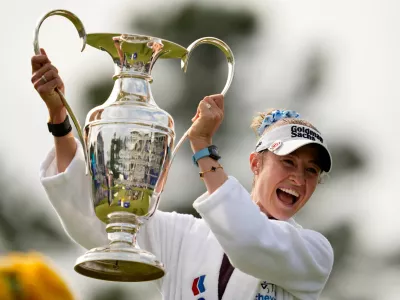 Nelly Korda holds the trophy after winning the Chevron Championship LPGA golf tournament Sunday, April 26, 2026, in Houston. (AP Photo/Ashley Landis)