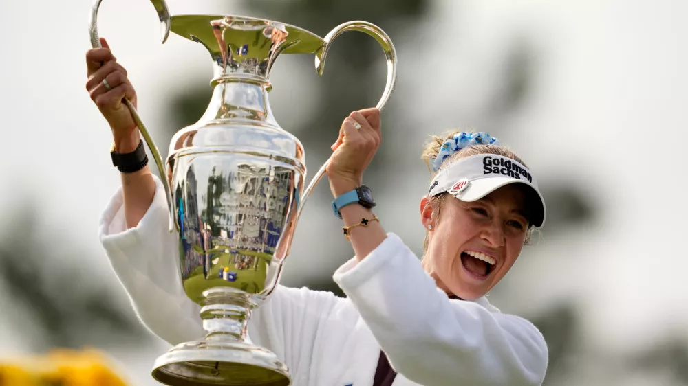 Nelly Korda holds the trophy after winning the Chevron Championship LPGA golf tournament Sunday, April 26, 2026, in Houston. (AP Photo/Ashley Landis)
