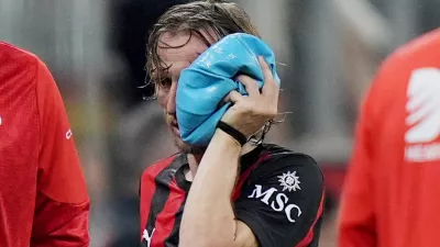 AC Milan's Luka Modric is injured during the Serie A soccer match between AC Milan and Juventus, in Milan, Italy, Sunday, April 26, 2026. (Spada/LaPresse via AP)