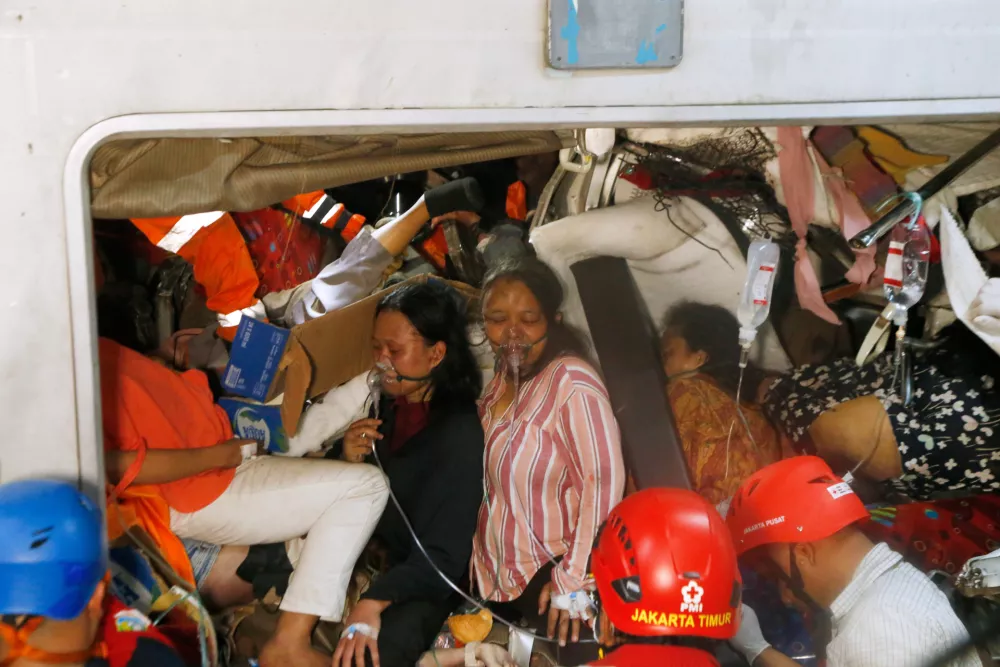 Passengers are being rescued after a train collision in Bekasi, Indonesia, Tuesday, April 28, 2026. (AP Photo)