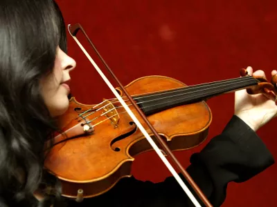 Priya Mitchell plays The Lady Tennant violin, made by Antonio Stradivari in 1699, in Christie's auction house in London, Friday March 4, 2005. The violin will be auctioned in Christie's New York Fine Musical Instruments sale on April 22, and is expected to realize between US0,000 and US.2 million (610,000-915,000).(AP Photo/John D McHugh)