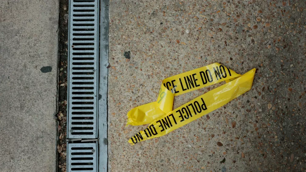 Police tape lies on the street outside the Washington Hilton hotel, where a shooting incident occurred yesterday night at the annual White House Correspondents' Association dinner, in Washington, D.C., U.S., April 26, 2026. REUTERS/Kylie Cooper