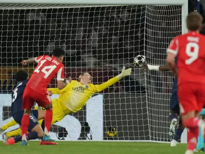 Bayern's Luis Diaz scores his side's fourth goal against PSG's goalkeeper Matvey Safonov during the Champions League semifinal first leg soccer match between Paris Saint-Germain and Bayern Munich in Paris, Tuesday, April 28, 2026. (AP Photo/Christophe Ena)