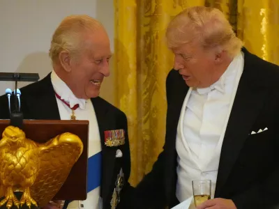 Britain's King Charles III talks with Britain's King Charles III during a State Dinner with first lady Melania Trump and Queen Camilla in the East Room of the White House State Dinner Tuesday, April 28, 2026, in Washington. (AP Photo/Alex Brandon)