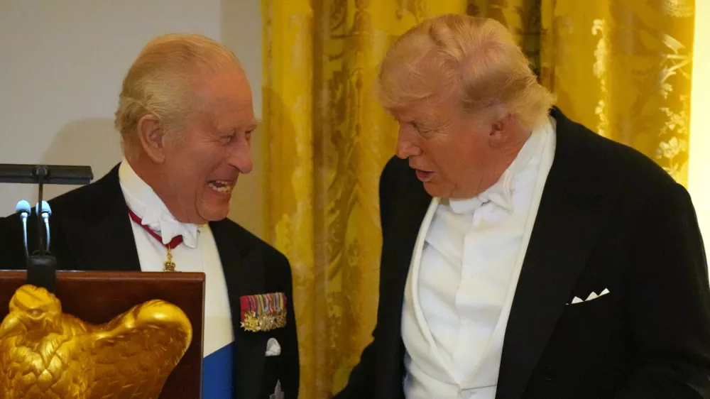 Britain's King Charles III talks with Britain's King Charles III during a State Dinner with first lady Melania Trump and Queen Camilla in the East Room of the White House State Dinner Tuesday, April 28, 2026, in Washington. (AP Photo/Alex Brandon)