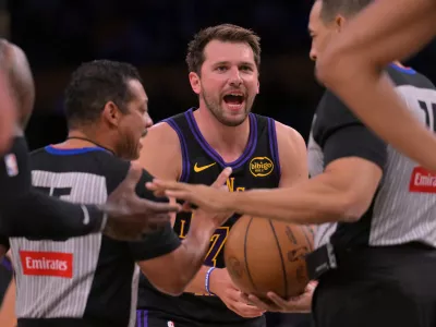 Mar 31, 2026; Los Angeles, California, USA; Los Angeles Lakers guard Luka Doncic (77) argues a foul call in the first half against the Cleveland Cavaliers at Crypto.com Arena. Mandatory Credit: Jayne Kamin-Oncea-Imagn Images