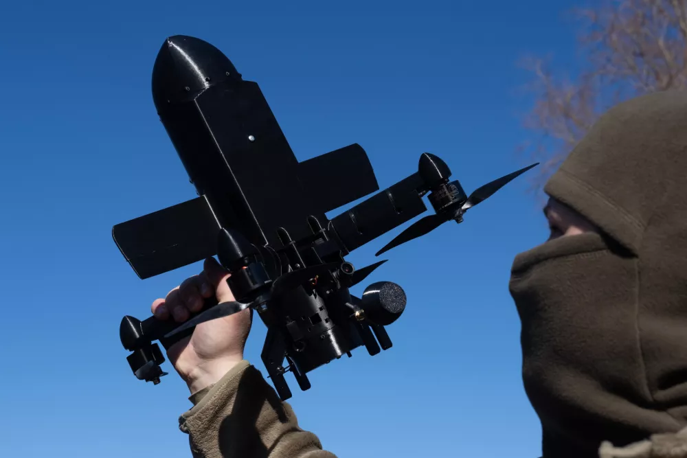 FILE - An instructor from the Ukrainian company General Cherry demonstrates the operation of an anti-air interceptor drone designed to destroy Russian attack drones in Kyiv region, on March 11, 2026. (AP Photo/Efrem Lukatsky, File)
