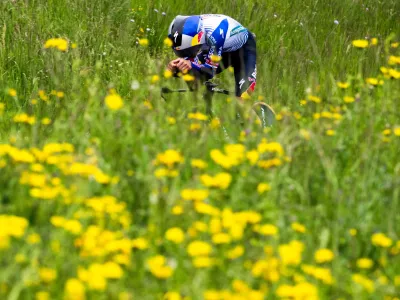 Primoz Roglic from Slovenia in action during the prologue, a 3,2 km race against the clock at the 79th Tour de Romandie UCI World Tour Cycling race, in Villars-sur-Glane, Switzerland, Tuesday, April 28, 2026. (Jean-Christophe Bott/Keystone via AP)