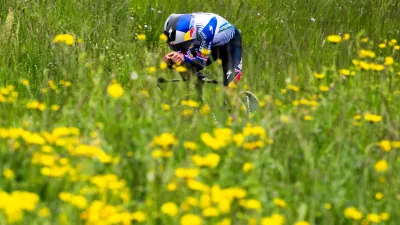 Primoz Roglic from Slovenia in action during the prologue, a 3,2 km race against the clock at the 79th Tour de Romandie UCI World Tour Cycling race, in Villars-sur-Glane, Switzerland, Tuesday, April 28, 2026. (Jean-Christophe Bott/Keystone via AP)