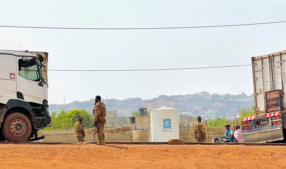 FILE PHOTO: Malian soldiers stand near a truck during a patrol following the attack on Mali's main military base Kati, outside the capital Bamako, in Kati, Mali, April 27, 2026. Picture taken with a mobile phone.  REUTERS/Stringer BEST QUALITY AVAILABLE./File Photo