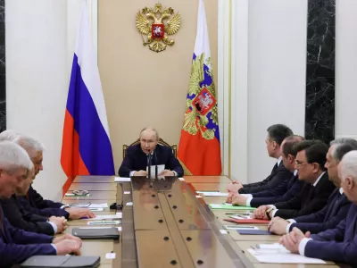 Russian President Vladimir Putin, center, speaks at the Kremlin in Moscow, Tuesday, April 28, 2026, during a meeting on providing security for the upcoming Russian Parliamentary elections. (Mikhail Metzel/Sputnik, Kremlin Pool Photo via AP)