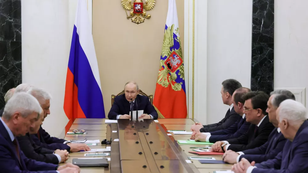 Russian President Vladimir Putin, center, speaks at the Kremlin in Moscow, Tuesday, April 28, 2026, during a meeting on providing security for the upcoming Russian Parliamentary elections. (Mikhail Metzel/Sputnik, Kremlin Pool Photo via AP)