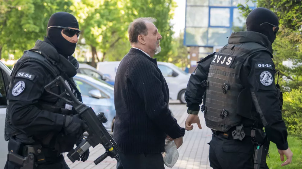 Juraj Cintula, who is facing charges of committing a serious crime of terrorist attack on Premier Robert Fico, arrives at the Supreme Court in Bratislava, Slovakia, Wednesday April, 29, 2026. (Martin Baumann/TASR via AP)