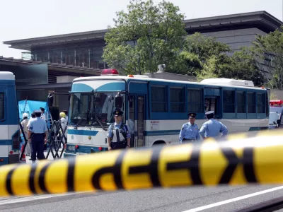 A crime-scene tape is placed around the compound of the official residence of Japanese Prime Minister Junichiro Koizumi in Tokyo while police investigate the building after a suicide attempt by a woman August 30, 2005. The woman, who tried to drive through barriers outside the compound, slit her throat, stabbed herself in the wrist and stomach, and was taken to hospital, condition unknown, police said. Koizumi was out campaigning at the time of the incident.  REUTERS/Yuriko Nakao