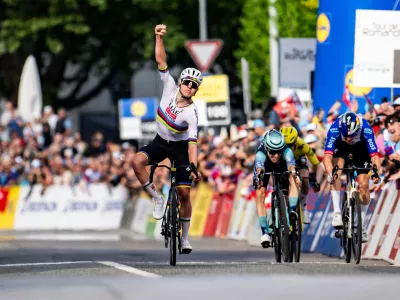 Slovenia's Tadej Pogacar celebrates winning the first stage, a 170,6 km race around Martigny, at the 79th Tour de Romandie cycling race, in Saint-Maurice, Switzerland, Wednesday, April 29, 2026. (Jean-Christophe Bott/Keystone via AP)