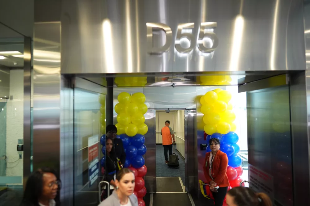 A passengers walks down the jet bridge to board American Airlines Flight AA3599, the first direct commercial flight between the United States and Venezuela in seven years, Thursday, April 30, 2026, at Miami International Airport in Miami. (AP Photo/Rebecca Blackwell)