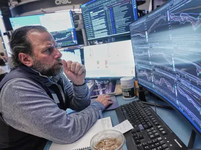 Specialist Michael Pistillo works at his post on the floor of the New York Stock Exchange, Thursday, April 30, 2026. (AP Photo/Richard Drew)