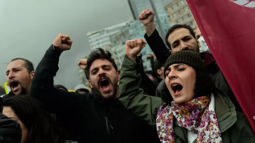 Union members shout slogans during scuffles with Turkish police as they try to march towards Taksim square in Istanbul, Turkey, Friday, May 1, 2026, during Labor Day celebrations. (AP Photo/Khalil Hamra)