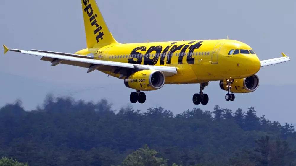 FILE - A Spirit Airlines 319 Airbus approaches Manchester Boston Regional Airport for a landing, June 2, 2023, in Manchester, N.H. (AP Photo/Charles Krupa, File)
