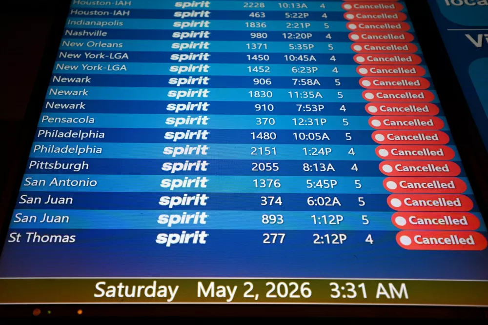 A departure board displays cancelled Spirit Airlines flights at Orlando International Airport, as the airline announced it was ceasing operations early Saturday morning following an impasse in talks with some creditors on a $500 million government bailout plan, in Orlando, Florida, U.S., May 2, 2026. REUTERS/Miguel Rodriguez 