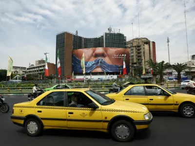 People drive past an anti-U.S. billboard depicting U.S. President Donald Trump and the Strait of Hormuz, in Tehran, Iran, May 2, 2026. Majid Asgaripour/WANA (West Asia News Agency) via REUTERS ATTENTION EDITORS - THIS PICTURE WAS PROVIDED BY A THIRD PARTY