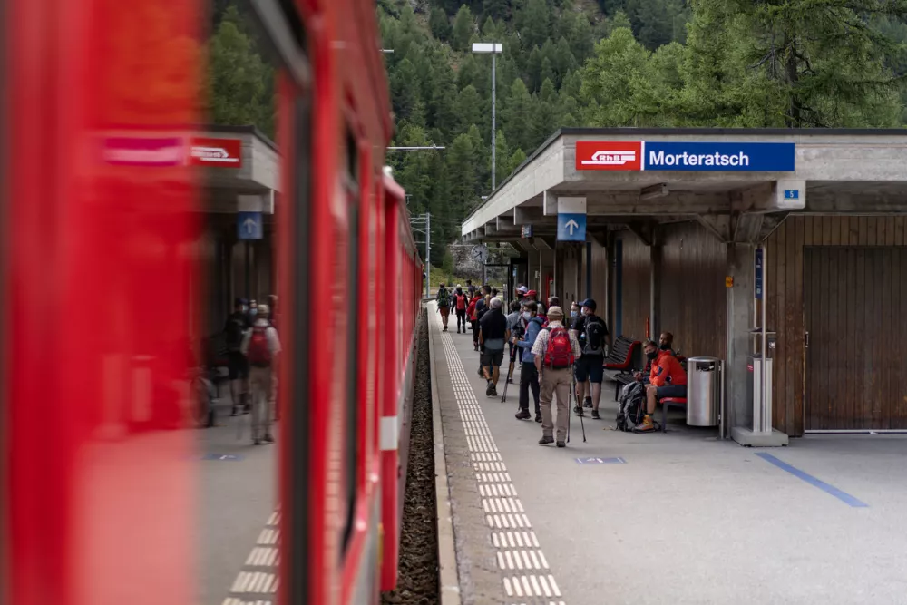 Morteratsch, Switzerland &ndash; September 13, 2020: The Rhaetian Railway (RhB) is a railroad in Switzerland in the canton of Grisons. The well-known Bernina Railway, which has been a UNESCO World Heritage Site since 2008, links the spa resort of St. Moritz over the Bernina Pass with the Italian town of Tirano.
