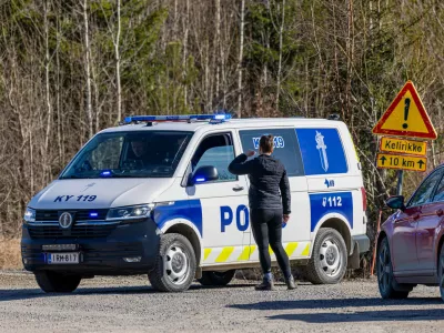 A Police car blocks the Savistontie road after two unidentified drones entered and landed in Finnish territory, in Kouvola, Finland, Sunday, March 29, 2026 (Sasu J&auml;rnstedt/Lehtikuva via AP)