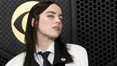 Billie Eilish wears ICE out pin as she poses at the red carpet during the 68th Annual Grammy Awards in Los Angeles, California, U.S., February 1, 2026. REUTERS/Mario Anzuoni