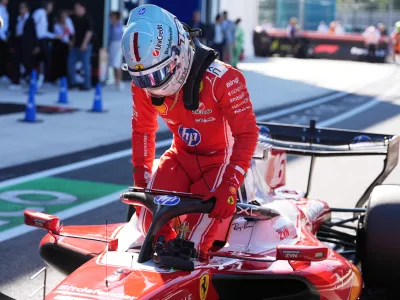 Ferrari driver Charles Leclerc of Monaco exits his car after a qualifying session for the Miami Formula One Grand Prix auto race, Saturday, May 2, 2026, in Miami Gardens, Fla. (AP Photo/Rebecca Blackwell)