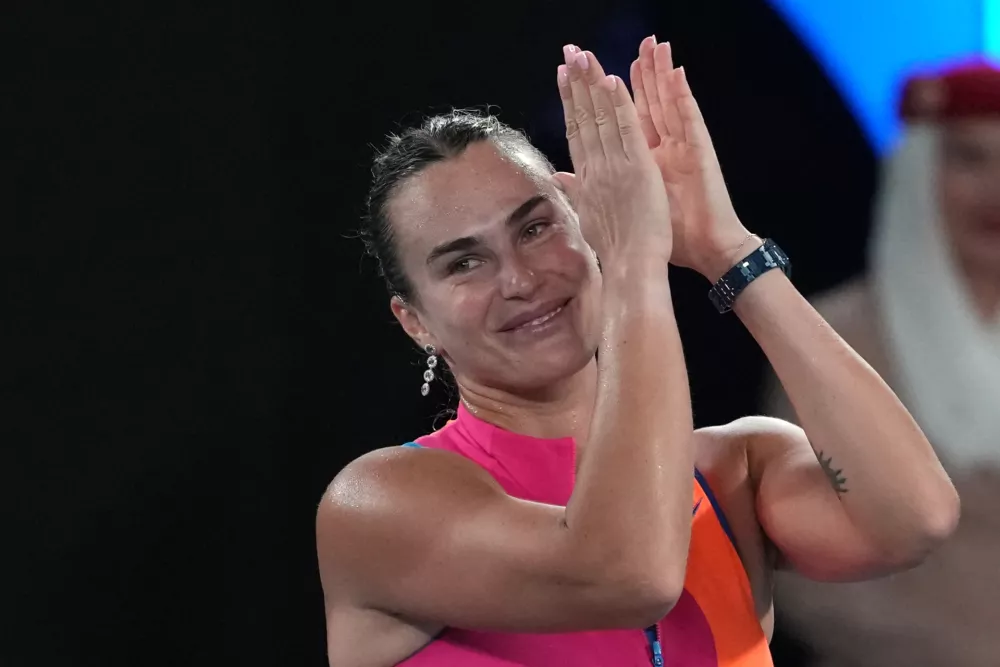 Aryna Sabalenka of Belarus celebrates after defeating Elina Svitolina of Ukraine in their semifinal match at the Australian Open tennis championship in Melbourne, Australia, Thursday, Jan. 29, 2026. (AP Photo/Aaron Favila)