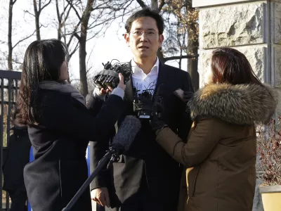 Lee Jae-yong, vice chairman of Samsung Electronics, speaks before leaving a detention center in Uiwang, South Korea, Monday, Feb. 5, 2018. A South Korean appeals court Monday handed down a 2 &Acirc;˝-year suspended jail sentence for corruption to Samsung heir Lee, clearing the way for him to be freed after nearly a year in prison and return to the company's leadership. (AP Photo/Ahn Young-joon)