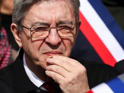 Jean-Luc Melenchon, leader of French far-left opposition party La France Insoumise (France Unbowed - LFI), listens to a speech during a rally against racism at the Mairie de Saint-Denis, called for by the newly elected mayor of Saint-Denis, Bally Bagayoko, in Saint Denis, Paris, April 4, 2026. REUTERS/Tom Nicholson