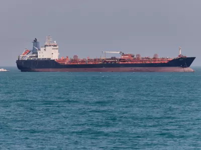An oil tanker sits at anchor in the Strait of Hormuz off Bandar Abbas, Iran, Saturday, May 2, 2026.(Amirhosein Khorgooi/ISNA via AP)