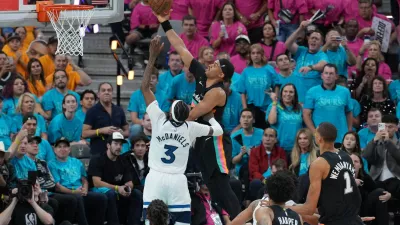 May 4, 2026; San Antonio, Texas, USA; San Antonio Spurs forward Keldon Johnson (3) shoots over Minnesota Timberwolves forward Jaden McDaniels (3) in the second half during game one of the second round of the 2026 NBA Playoffs at Frost Bank Center. Mandatory Credit: Daniel Dunn-Imagn Images