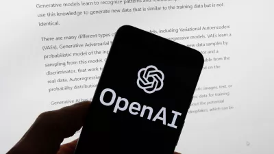 FILE - The OpenAI logo is displayed on a mobile phone in front of a computer screen with output from ChatGPT, March 21, 2023, in Boston. (AP Photo/Michael Dwyer, File)