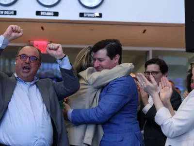 Managing Editor Peter Spiegel reacts while Politics and Government Editors Lori Montgomery and Nick Baumann hug after the announcement of The Washington Post winning the Pulitzer Prize for Public Service during the 2025 Pulitzer Prizes in the newsroom on May 4, 2026, in Washington D.C. The Washington Post was named the winner in Feature Photography and Public Service categories as well as a finalist in National Reporting. Tom Brenner/Washington Post via REUTERS/Handout via REUTERS  THIS IMAGE HAS BEEN SUPPLIED BY A THIRD PARTY FOR USE ONLY WITH THE WASHINGTON POST 2026 PULITZER ANNOUNCEMENT. NO ARCHIVES. NO SALES.