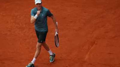 Jannik Sinner, of Italy, celebrates after winning the men's singles tennis final match against Alexander Zverev, of Germany, at the Madrid Open tennis tournament in Madrid, Spain, Sunday, May 3, 2026. (AP Photo/Manu Fernandez)