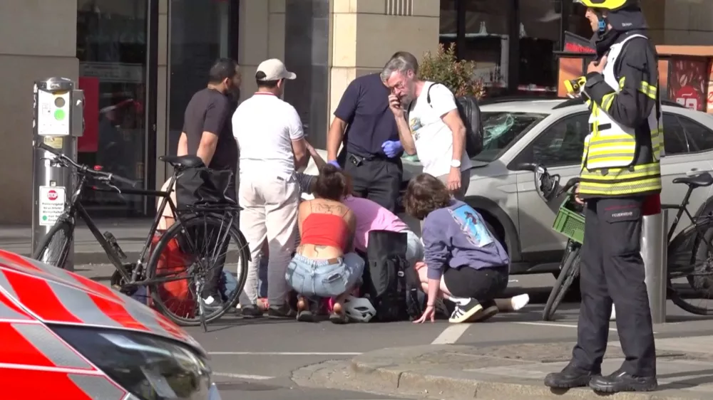 People gather after a car ran into a crowd, in Leipzig, Germany, May 4, 2026, in this screengrab taken from a handout video. NEWS 5/Handout via REUTERS  THIS IMAGE HAS BEEN SUPPLIED BY A THIRD PARTY. GERMANY OUT. NO COMMERCIAL OR EDITORIAL SALES IN GERMANY