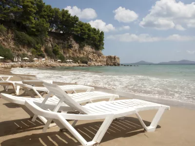 Alonissos - Lounge chairs on sandy beach