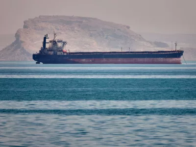 A bulk cargo ship sits at anchor in the Strait of Hormuz off Bandar Abbas, Iran, Saturday, May 2, 2026.(Amirhosein Khorgooi/ISNA via AP)
