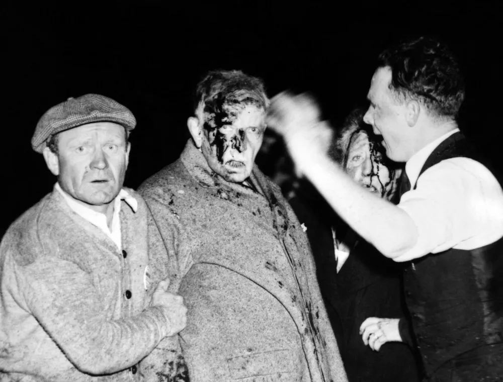 Injured in the Hindenburg Crash. Survivors are dazed and bloodied by the explosion, fire and crash, a man and women passenger are given first aid before going to the hospital. There were among the 23 passengers who survived the wreck. 13 passengers were killed. May 6, 1937. (CSU_ALPHA_1451) CSU Archives/Everett Collection,Image: 148306147, License: Rights-managed, Restrictions: For usage credit please use;, Model Release: no