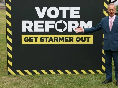 Britain's Reform UK leader Nigel Farage gestures during a photocall near the Houses of Parliament, ahead of upcoming local and mayoral elections in England and devolved parliamentary elections in Scotland and Wales on May 7, in London, Britain, May 6, 2026. REUTERS/Toby Melville