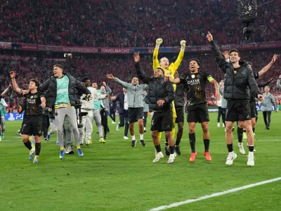 PSG players celebrate after the Champions League semifinal second leg soccer match between Bayern Munich and Paris Saint Germain in Munich, Germany, Wednesday, May 6, 2026. (AP Photo/Martin Meissner)